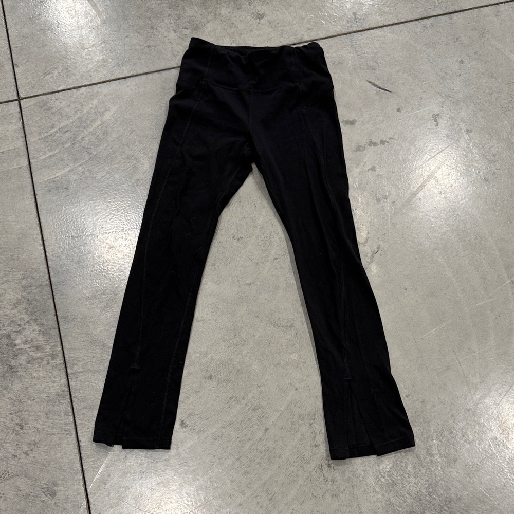 Athleta Girl high rise chit chat split hem leggings.